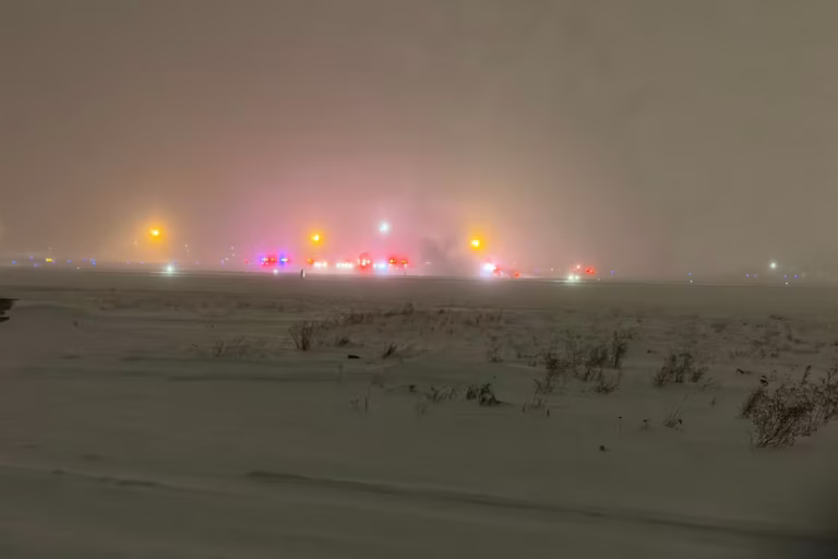 Lights in the distance Sunday night after a private Bombardier Challenger 600 jet crashed at Bangor International Airport in Maine.@3315Aviation