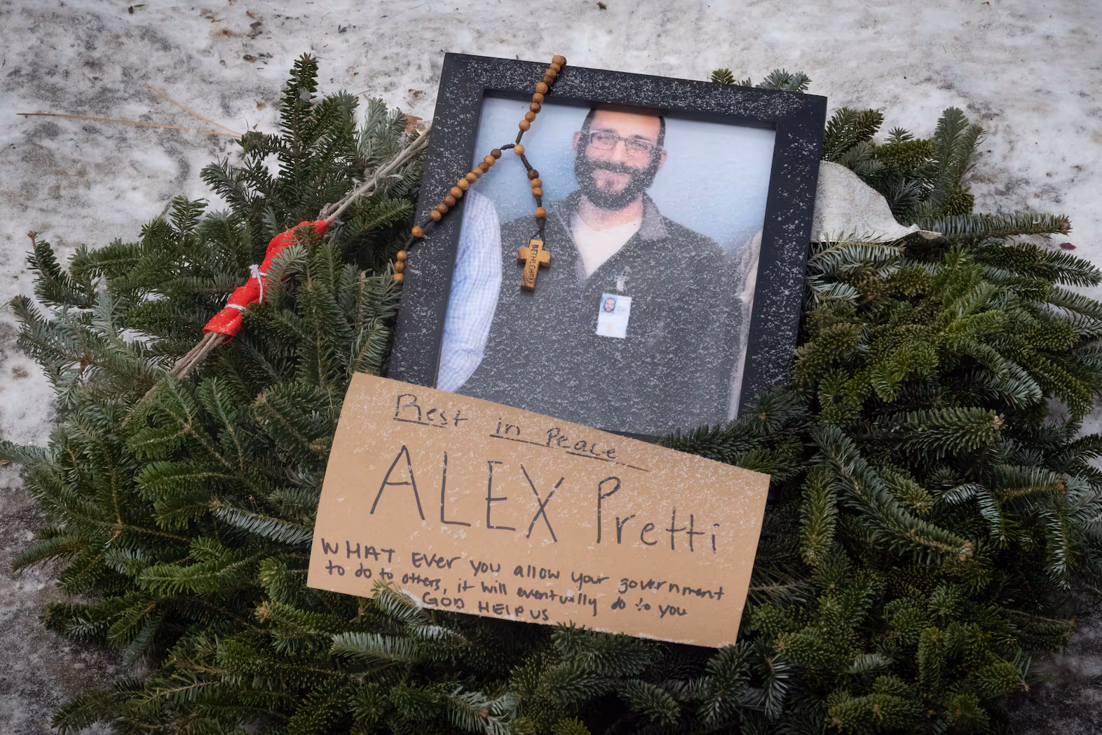 A picture sits at a memorial to Alex Pretti on Jan. 25, 2026 in Minneapolis, Minn.  Scott Olson