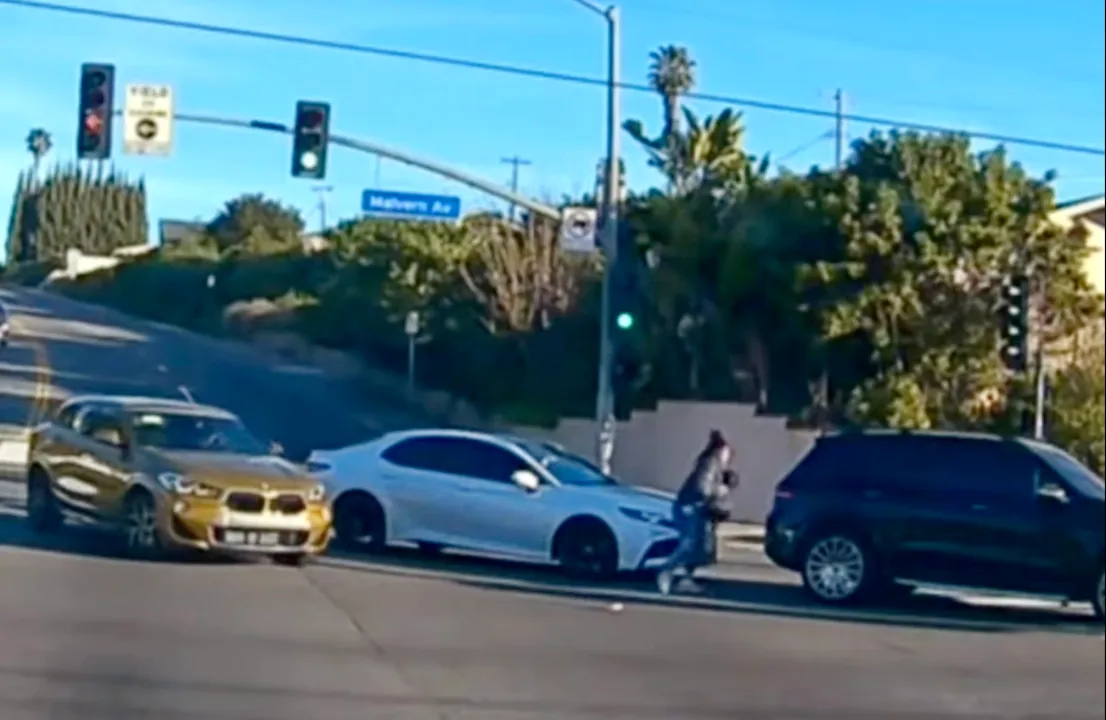A 35-year-old La Habra mother has been arrested on suspicion of child abuse after her 19-month-old baby fell out of her moving SUV while making a left turn through a Fullerton intersection on Tuesday, Jan. 20, 2025, according to police and a video that ended up online. (Screenshot from YouTube video)