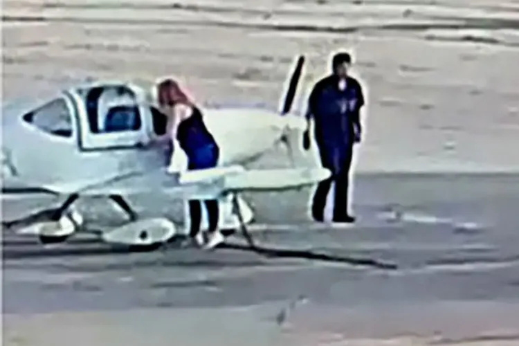 A photo of the suspect near a plane. Credit : FBI Los Angeles